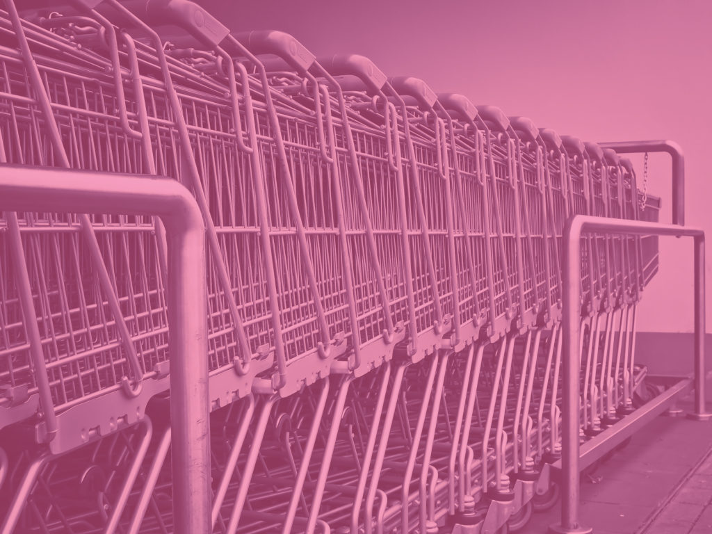 graphic of shopping carts with a pink overlay